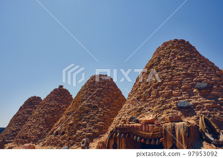 Roofs of beehive houses opposite bright clear sky 97953092