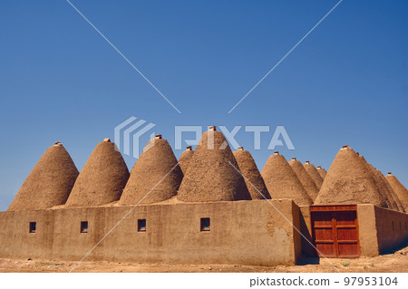 Beehive houses opposite bright clear sky Beehive houses opposite bright clear sky 97953104