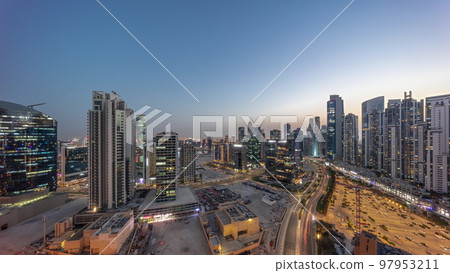 Business Bay with modern towers residential development aerial panoramic day to night timelapse, Dubai 97953211