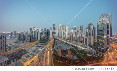 Bay Avenue with modern towers residential development in Business Bay aerial panoramic night to day timelapse, Dubai Bay Avenue with modern towers residential development in Business Bay aerial panoramic night to day timelapse, Dubai 97953212
