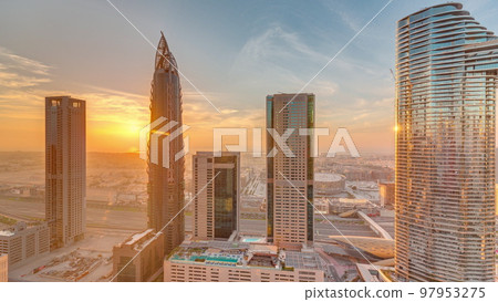 Sky view to skyscrapers during sunset in Dubai downtown aerial timelapse. 97953275