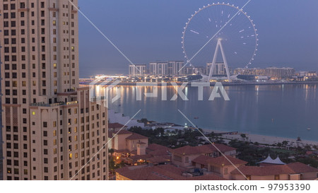 Bluewaters island with modern architecture and ferris wheel aerial night to day timelapse. Bluewaters island with modern architecture and ferris wheel aerial night to day timelapse. 97953390