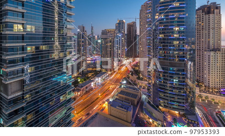 Panoramic view of the Dubai Marina and JBR area and the famous Ferris Wheel aerial day to night timelapse Panoramic view of the Dubai Marina and JBR area and the famous Ferris Wheel aerial day to night timelapse 97953393