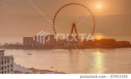 Sunset over Bluewaters island with modern architecture and ferris wheel aerial timelapse. Sunset over Bluewaters island with modern architecture and ferris wheel aerial timelapse. 97953395