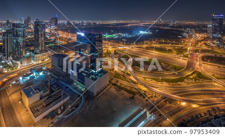 Aerial panoramic view of media city district and highway junction all night timelapse 97953409