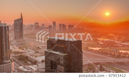 Sunrise over media city and al barsha heights district area night to day timelapse from Dubai marina. Sunrise over media city and al barsha heights district area night to day timelapse from Dubai marina. 97953412