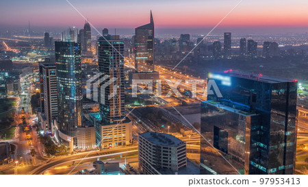 Aerial view of media city and al barsha heights district area night to day timelapse from Dubai marina. Aerial view of media city and al barsha heights district area night to day timelapse from Dubai marina. 97953413