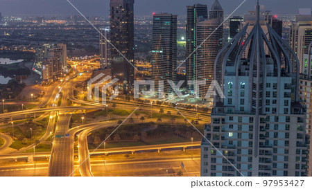 Huge highway crossroad junction between JLT district and Dubai Marina night to day timelapse. Huge highway crossroad junction between JLT district and Dubai Marina night to day timelapse. 97953427