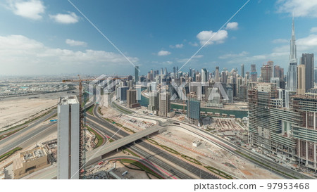 Panorama showing skyline of Dubai with business bay and downtown district timelapse. 97953468