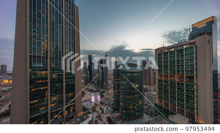 Dubai international financial center skyscrapers aerial day to night timelapse. Dubai international financial center skyscrapers aerial day to night timelapse. 97953494
