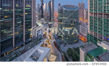 Dubai international financial center skyscrapers aerial night to day timelapse. 97953498
