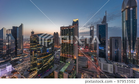 Dubai international financial center skyscrapers aerial day to night timelapse. Dubai international financial center skyscrapers aerial day to night timelapse. 97953502