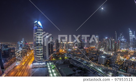 Dubai's business bay towers aerial all night timelapse. Rooftop view of some skyscrapers 97953515