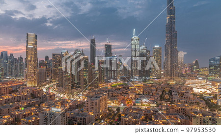 Dubai Downtown day to night transition timelapse with tallest skyscraper and other towers Dubai Downtown day to night transition timelapse with tallest skyscraper and other towers 97953530