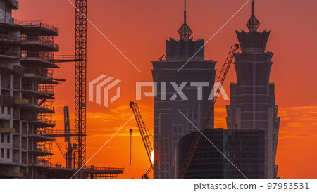 Dubai's business bay towers at sunset aerial timelapse. Rooftop view of some skyscrapers 97953531