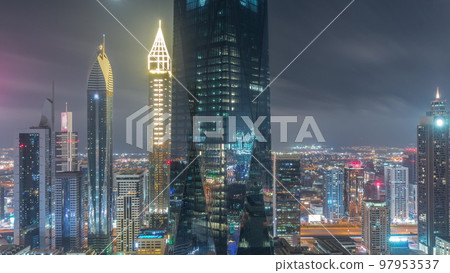 Financial center of Dubai city with luxury skyscrapers all night timelapse, Dubai, United Arab Emirates Financial center of Dubai city with luxury skyscrapers all night timelapse, Dubai, United Arab Emirates 97953537