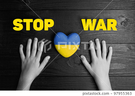 child hands with ukraine heart 97955363