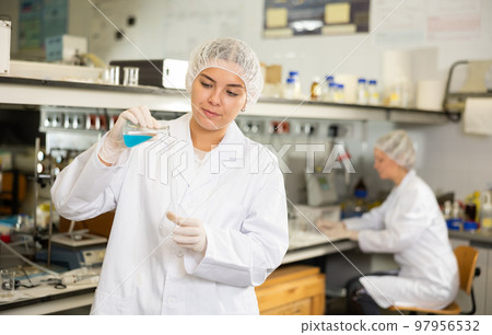 Shot of an young woman using equipment to work in a laboratory 97956532
