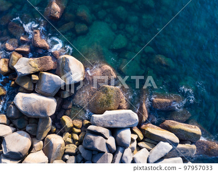 Amazing top view beautiful seashore, Aerial view crashing waves on rocks, Beautiful sea in Phuket island Thailand 97957033