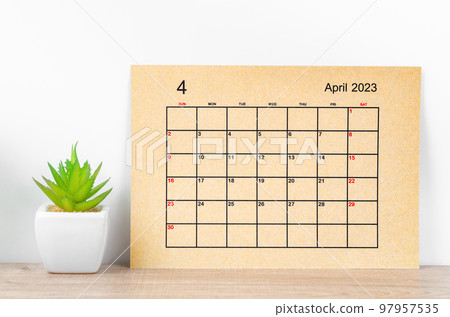 The Brown April 2023 Monthly calendar for 2023 year with plant pot on wooden table. The Brown April 2023 Monthly calendar for 2023 year with plant pot on wooden table. 97957535