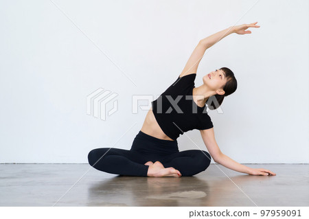 Women doing yoga and flexibility exercises 97959091