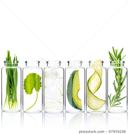 Homemade skin care with natural ingredients wheat grass ,avocado ,aloe vera ,cucumber twist ,centella asiatica and rosemary in glass bottles isolate on white background. 97959286