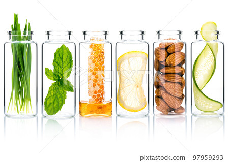 Homemade skin care with natural ingredients wheat glass ,cucumber slice ,almonds ,honeycomb ,lemon slice and mint leaves in glass bottles isolate on white background. Homemade skin care with natural ingredients wheat glass ,cucumber slice ,almonds ,honeycomb ,lemon slice and mint leaves in glass bottles isolate on white background. 97959293