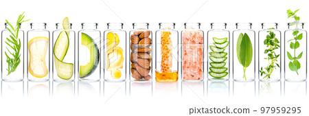 Homemade skin care with natural ingredients avocado ,aloe vera ,cucumber ,himalayan salt ,honeycomb ,almonds, ginger slice and rosemary in glass bottles isolate on white background. Homemade skin care with natural ingredients avocado ,aloe vera ,cucumber ,himalayan salt ,honeycomb ,almonds, ginger slice and rosemary in glass bottles isolate on white background. 97959295