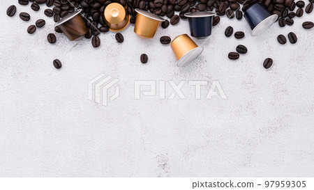 Dark roasted coffee beans setup on white concrete background with copy space. Dark roasted coffee beans setup on white concrete background with copy space. 97959305