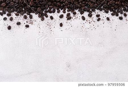 Dark roasted coffee beans setup on white concrete background with copy space. Dark roasted coffee beans setup on white concrete background with copy space. 97959306
