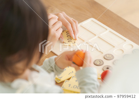 Parents and children studying money 97959412