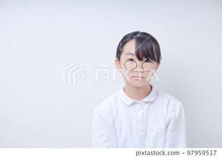 Expressionless glasses girl wearing a white polo shirt Expressionless glasses girl wearing a white polo shirt 97959517