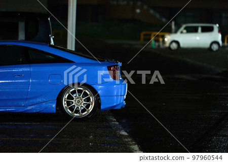 Parked sports car at night 97960544