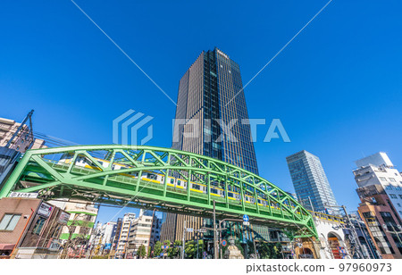 Tokyo cityscape in Japan View of the Sobu Line running over the Sobu Main Line Matsuzumicho overpass over the Shoheibashi intersection 97960973