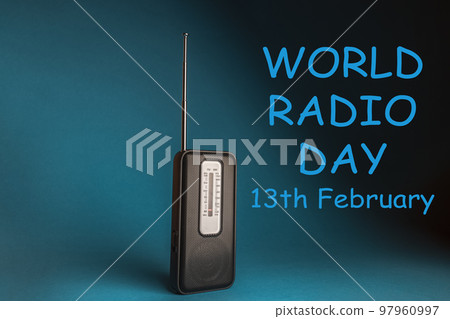 World Radio Day 13 February text with radio on blue background. Selective focus 97960997