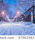 Snow road and houses along the road 97962983