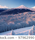 Snowy mountains and snow-covered trees 97962990