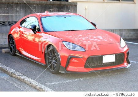 Image of a red sports car in the parking lot Image of a red sports car in the parking lot 97966136