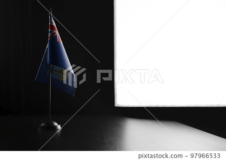 Small national flag of the Montserrat on a black background 97966533
