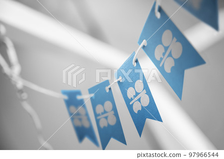A garland of Organization of the Petroleum Exporting Countries national flags on an abstract blurred background 97966544