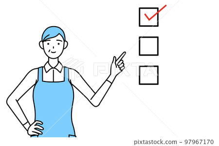 Senior woman wearing an apron pointing to a checklist 97967170