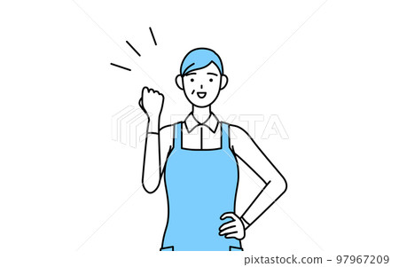 Senior woman wearing an apron doing a guts pose 97967209