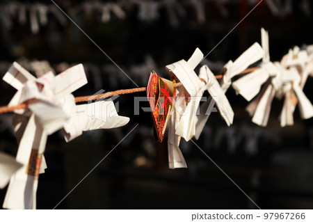 Omikuji tied to a string 97967266