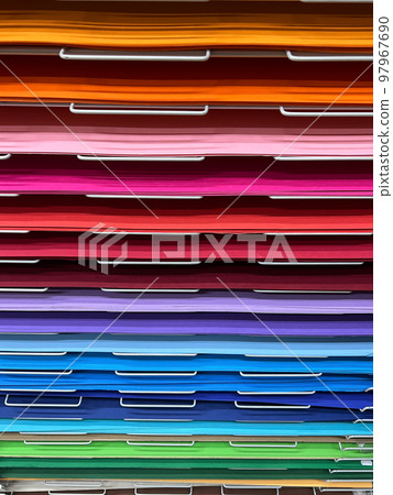 various art colored paper cardboard canvas samples on display shelf 97967690