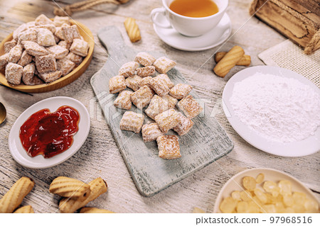 Cookies sprinkled with powdered sugar Cookies sprinkled with powdered sugar 97968516