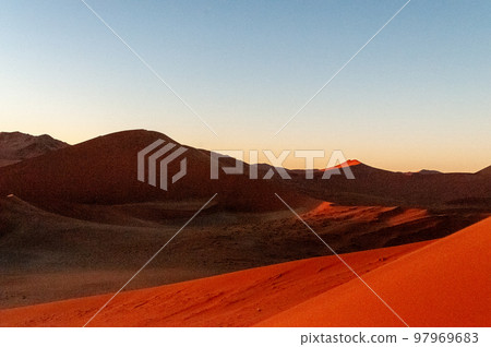 Climbing Dune 45 at sunrise 97969683