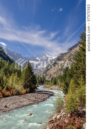 Beautiful view of the mountain river in Gran Paradiso National Park between the Alpine slopes Beautiful view of the mountain river in Gran Paradiso National Park between the Alpine slopes 97970563