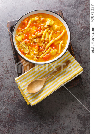 Rancho Canario is a traditional Canarian soup, with a stew-like consistency from the Canary Islands closeup on the plate. Vertical top view 97971337