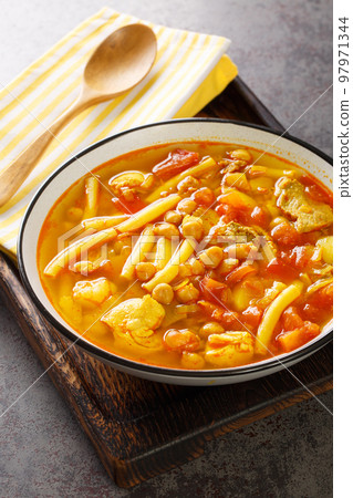 Rancho Canario stew Canary Islands traditional Food closeup on the board. Vertical 97971344