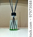 Domestic aroma diffuser in bottle running out. Empty diffuser perfume. 97973088